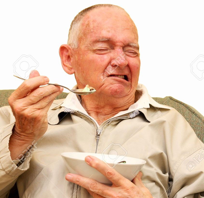 4553245 senior man pulling a funny face while eating some ice cream stock photo